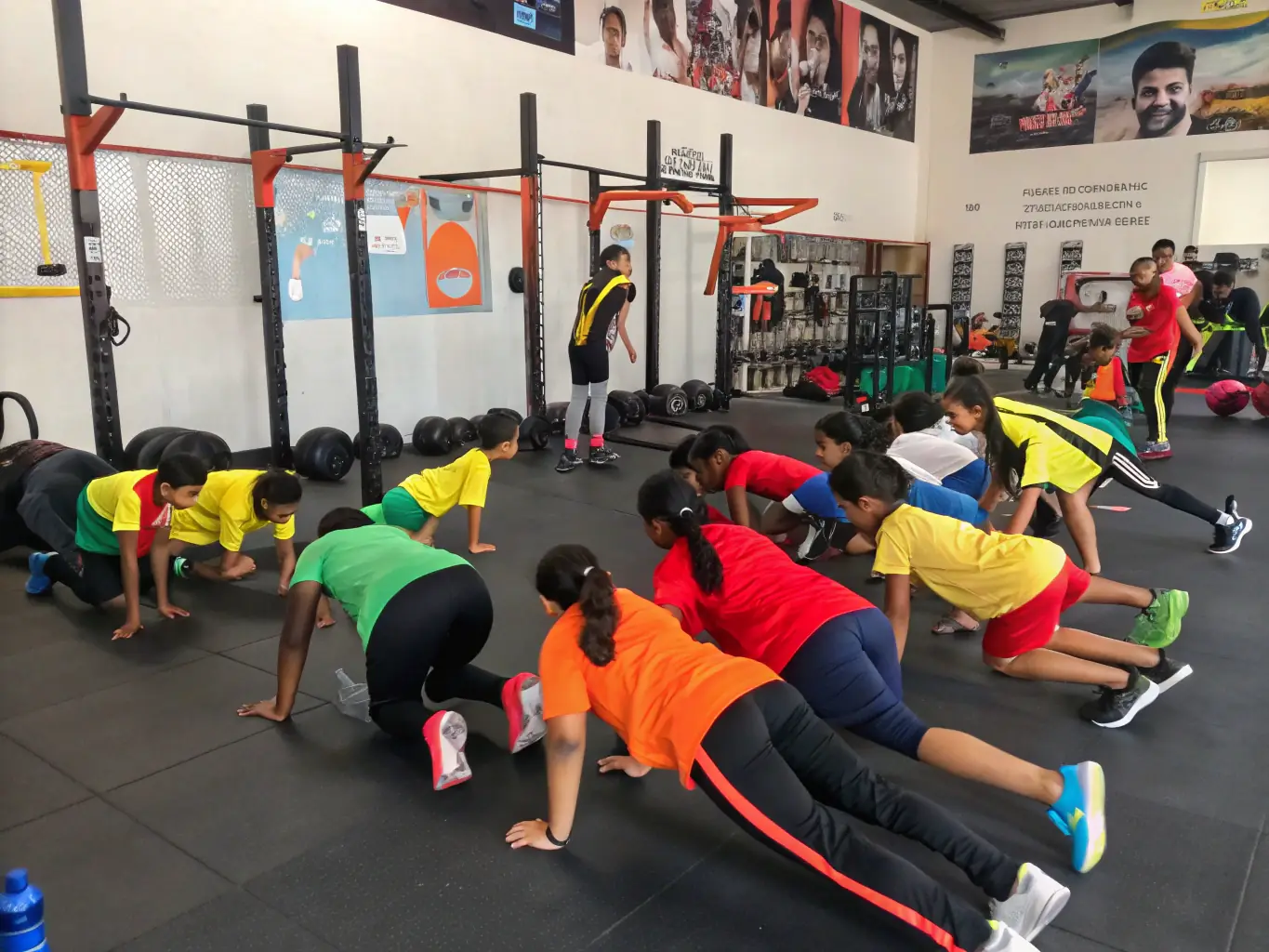 An image showcasing a group of students participating in a fitness-focused Krav Maga session, emphasizing the physical conditioning aspects of the training. The students are engaged in various exercises that improve strength, agility, and endurance.